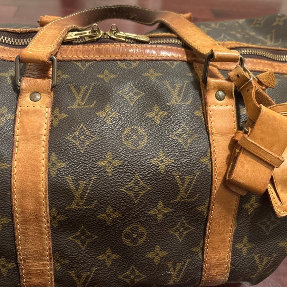 Louis Vuitton duffle bag see pics for wear bought at holt renfrew - Picture 1 of 13
